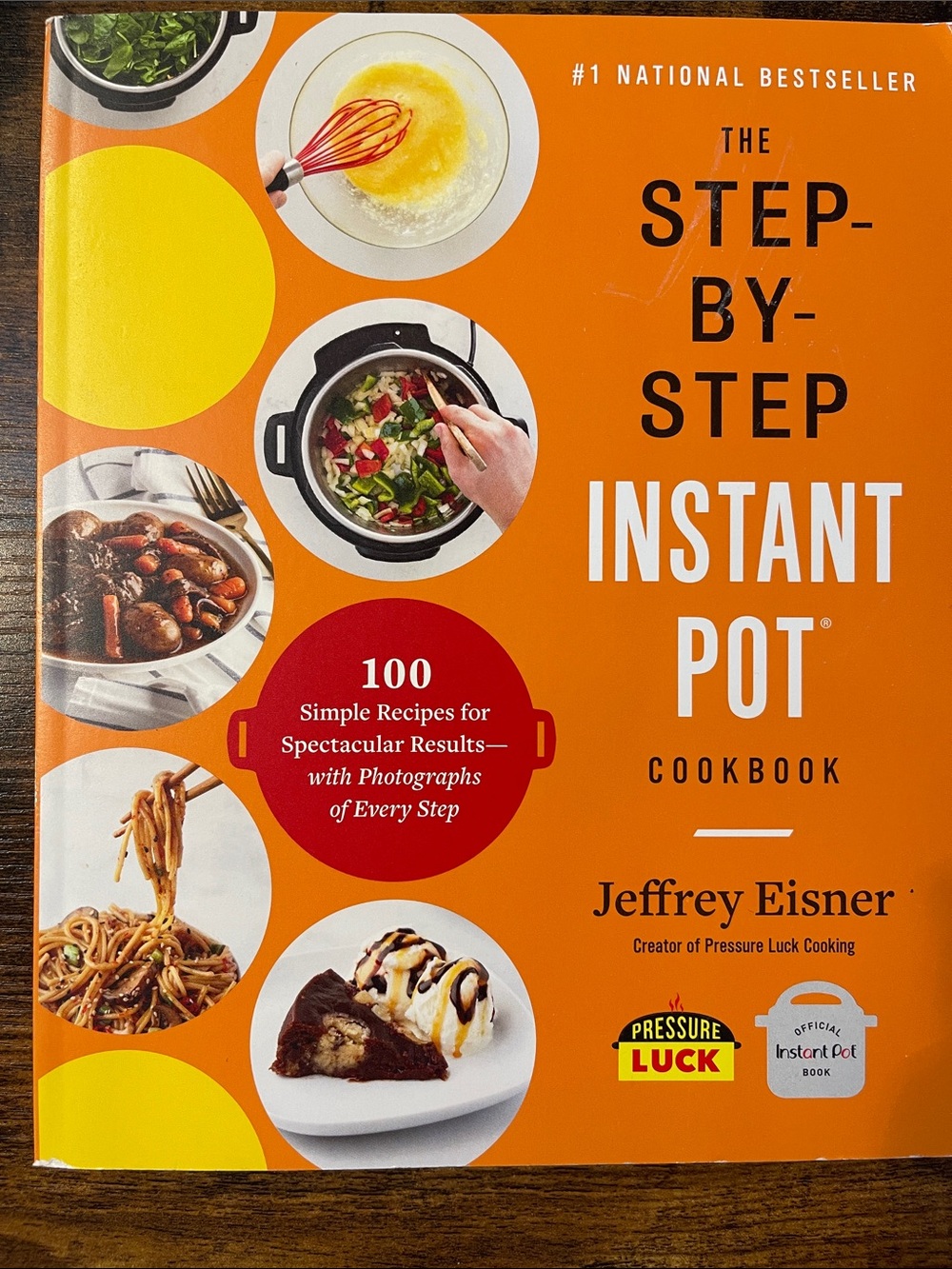 The Step-by-Step Instant Pot Cookbook by Jeffrey Eisner - Orange Cover